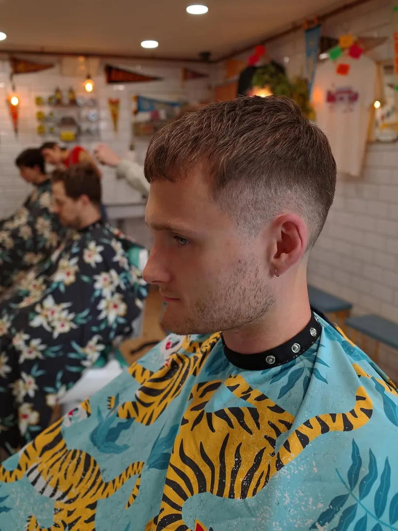 Sharp skin fade and crop in profile, cut at Tallboys Barbershop, Brighton